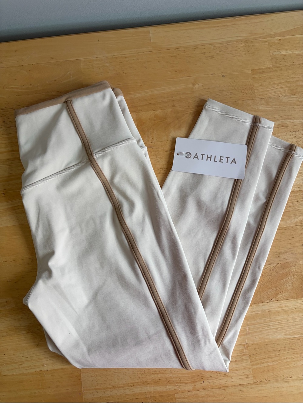 Athleta Cream Leggings with Tan Piping Detail